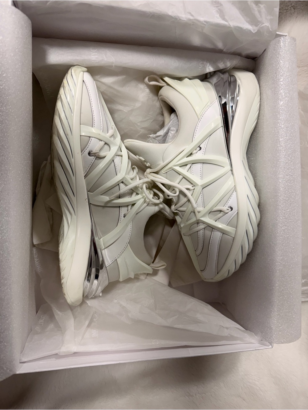 Jimmy Choo Off-White Sneakers with Silver Heel Detail